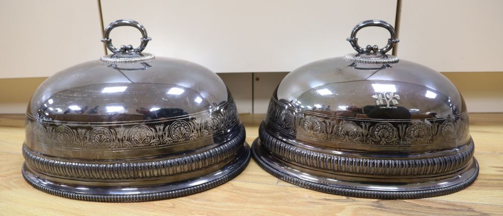 A pair of Victorian silver plated meat domes